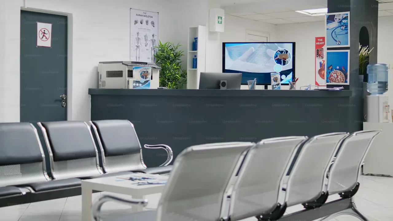 Clinic reception and waiting area with seating and a reception desk